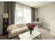 Bright living room features a comfy sofa, coffee table, and a view to a dining area at 10823 Verawood Dr, Riverview, FL 33579