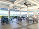 Relaxing poolside patio furniture with lake views at 10823 Verawood Dr, Riverview, FL 33579