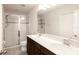 Double vanity bathroom with a large walk-in shower and tile flooring at 10823 Verawood Dr, Riverview, FL 33579