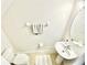 Clean and updated half bathroom with pedestal sink and oval mirror at 10823 Verawood Dr, Riverview, FL 33579