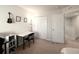 Bright bedroom with a home office setup and access to a loft area at 10823 Verawood Dr, Riverview, FL 33579