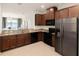 Modern kitchen with stainless steel appliances and granite countertops at 10823 Verawood Dr, Riverview, FL 33579