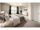Main bedroom with large window, dresser, and neutral decor at 10823 Verawood Dr, Riverview, FL 33579