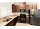 Modern kitchen with stainless steel appliances and granite countertops at 10823 Verawood Dr, Riverview, FL 33579