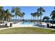 Resort-style pool with palm trees and lounge chairs at 10823 Verawood Dr, Riverview, FL 33579