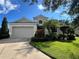 One-story house with attached garage and landscaping at 12143 Maple Ridge Dr, Parrish, FL 34219