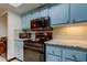 Updated kitchen with light blue cabinets and modern appliances at 9537 86Th Ave # 9537, Seminole, FL 33777