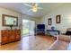 Spacious living room with hardwood floors and access to patio at 9537 86Th Ave # 9537, Seminole, FL 33777