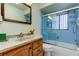 Bathroom with tub, shower and wood vanity at 9537 86Th Ave # 9537, Seminole, FL 33777