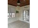 Sunroom with tiled floors and french doors leading to the outdoors at 13319 Boca Ciega Ave, Madeira Beach, FL 33708