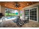 Relaxing outdoor area with a pool, covered patio, and summer kitchen at 19554 Autumn Oak Ln, Brooksville, FL 34601