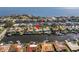 Aerial view of waterfront home with private dock, showcasing surrounding neighborhood and water access at 1973 Hawaii Ne Ave, St Petersburg, FL 33703