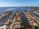 Aerial view of waterfront home with private dock, showcasing surrounding neighborhood and water access at 1973 Hawaii Ne Ave, St Petersburg, FL 33703