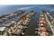 Aerial view of waterfront home with private dock, showcasing surrounding neighborhood and water access at 1973 Hawaii Ne Ave, St Petersburg, FL 33703