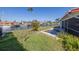 Backyard with canal view and a neglected pool area at 1973 Hawaii Ne Ave, St Petersburg, FL 33703