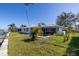 Backyard with canal view, and a neglected pool at 1973 Hawaii Ne Ave, St Petersburg, FL 33703