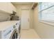 Laundry room with washer, dryer, and storage at 1301 Alicia Ave, Tampa, FL 33604