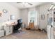 Functional bedroom featuring neutral walls, carpet floors, and a dedicated desk space at 18827 Boatwright Cir, Land O Lakes, FL 34638