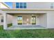 Back patio and view to the home's backyard at 32707 Tamarind Grove Ln, Wesley Chapel, FL 33543