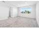 An open bedroom with a large window for lots of natural light at 32707 Tamarind Grove Ln, Wesley Chapel, FL 33543