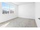 A brightly lit bedroom offers natural light and neutral colors at 32707 Tamarind Grove Ln, Wesley Chapel, FL 33543