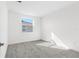 Neutral bedroom with carpet and natural light from one window at 32707 Tamarind Grove Ln, Wesley Chapel, FL 33543