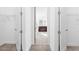 Large walk-in closet leading to the ensuite bathroom, providing ample storage space and convenience at 32707 Tamarind Grove Ln, Wesley Chapel, FL 33543