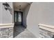 Inviting entryway with stone accents and a stylish double door entry, creating a grand entrance at 32707 Tamarind Grove Ln, Wesley Chapel, FL 33543
