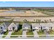 A street view of beautifully landscaped homes in a new development, complete with sidewalks and green spaces at 32707 Tamarind Grove Ln, Wesley Chapel, FL 33543