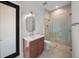 Modern bathroom featuring glass enclosed shower, stylish vanity and neutral color palette at 5024 W Dickens Ave, Tampa, FL 33629