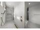 Modern bathroom featuring a marble shower with gold fixtures and a spacious design at 5024 W Dickens Ave, Tampa, FL 33629
