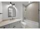 Well-appointed bathroom with neutral tile, double vanity, and a soaking tub at 5024 W Dickens Ave, Tampa, FL 33629