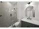 Stylish bathroom featuring a glass shower, vanity with sink, and elegant fixtures at 5024 W Dickens Ave, Tampa, FL 33629