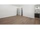 Spacious bedroom with hardwood floors, white trim, and an attached bath at 5024 W Dickens Ave, Tampa, FL 33629