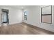 Bright bedroom with hardwood floors and two large windows allowing for plenty of natural light at 5024 W Dickens Ave, Tampa, FL 33629