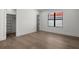 Comfortable bedroom with hardwood floors, closet, and a window offering natural light at 5024 W Dickens Ave, Tampa, FL 33629