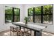 Bright dining room with designer table and chairs, with views to the outdoor garden at 5024 W Dickens Ave, Tampa, FL 33629