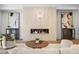 Cozy living room featuring a modern fireplace, stylish decor, and comfortable seating arrangements at 5024 W Dickens Ave, Tampa, FL 33629