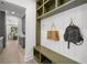 Mudroom featuring built-in storage with hooks and shelving, and a view of the front yard at 5024 W Dickens Ave, Tampa, FL 33629