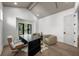 Bright office with modern desk, seating, vaulted ceiling, and large window at 5024 W Dickens Ave, Tampa, FL 33629