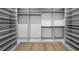 Spacious walk-in closet with custom shelves, drawers, and hanging racks at 5024 W Dickens Ave, Tampa, FL 33629