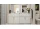 Clean and modern bathroom with double vanity and walk-in shower at 103 Lilyan Ct, Rotonda West, FL 33947