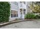 Ground level condo entry with private porch and landscaping at 800 S Dakota Ave # 116, Tampa, FL 33606