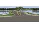 Gated entrance to The Strand community with a lake view at 2719 Winding Creek Trl, North Port, FL 34289