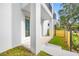 Private patio with modern sliding glass door and wood fence at 315 15Th N St, St Petersburg, FL 33705
