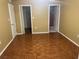 Bedroom with wood floors and built-in closet at 11201 80Th Ave # 201, Seminole, FL 33772