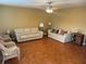 Spacious living room featuring parquet flooring and ample natural light at 11201 80Th Ave # 201, Seminole, FL 33772
