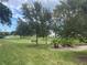 Landscaped grounds with a pond, walking paths, and lush vegetation at 11201 80Th Ave # 201, Seminole, FL 33772