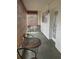 Bright sunroom with wicker furniture and bamboo shades at 11201 80Th Ave # 201, Seminole, FL 33772