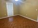 Bright bedroom with wood flooring and an exterior door at 11201 80Th Ave # 201, Seminole, FL 33772